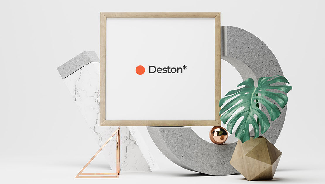 Geometric decor with Deston logo and plant.