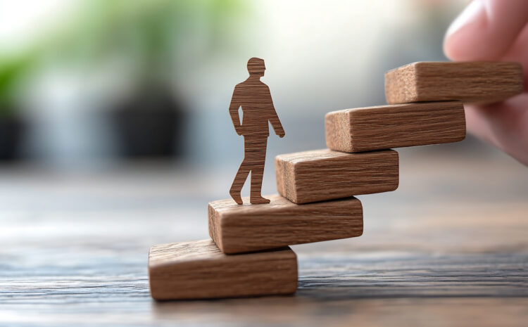 Person climbing stairs made of wooden blocks.