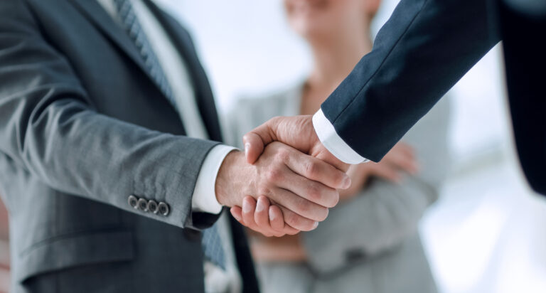 Handshake between two business professionals.