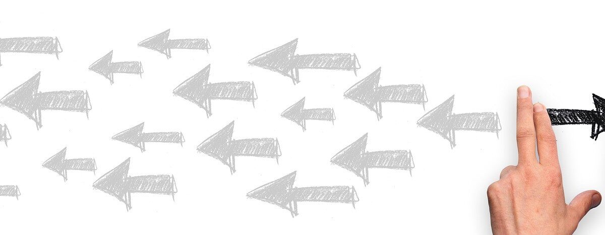 Person drawing arrow in opposite direction.