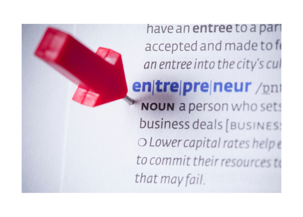 Red pushpin highlighting "entrepreneur" in dictionary.